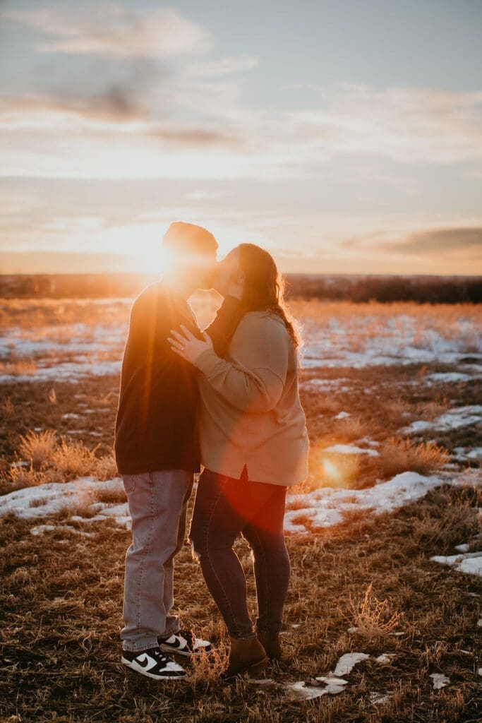 Couple embracing under dramatic Montana sky near Billings