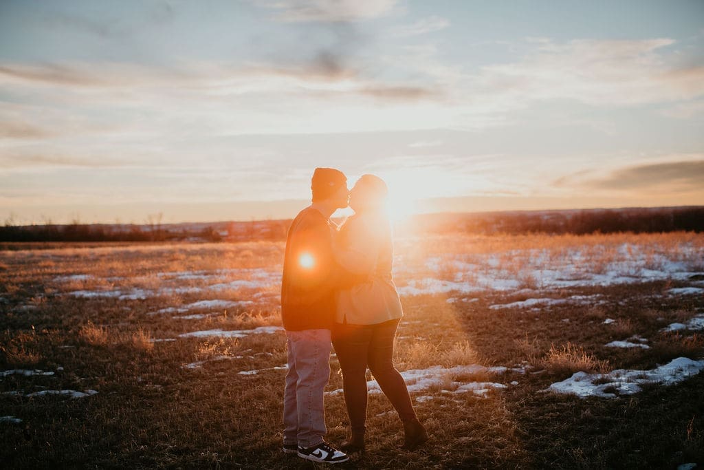 Sunlit kiss captured by Billings Montana wedding photographer