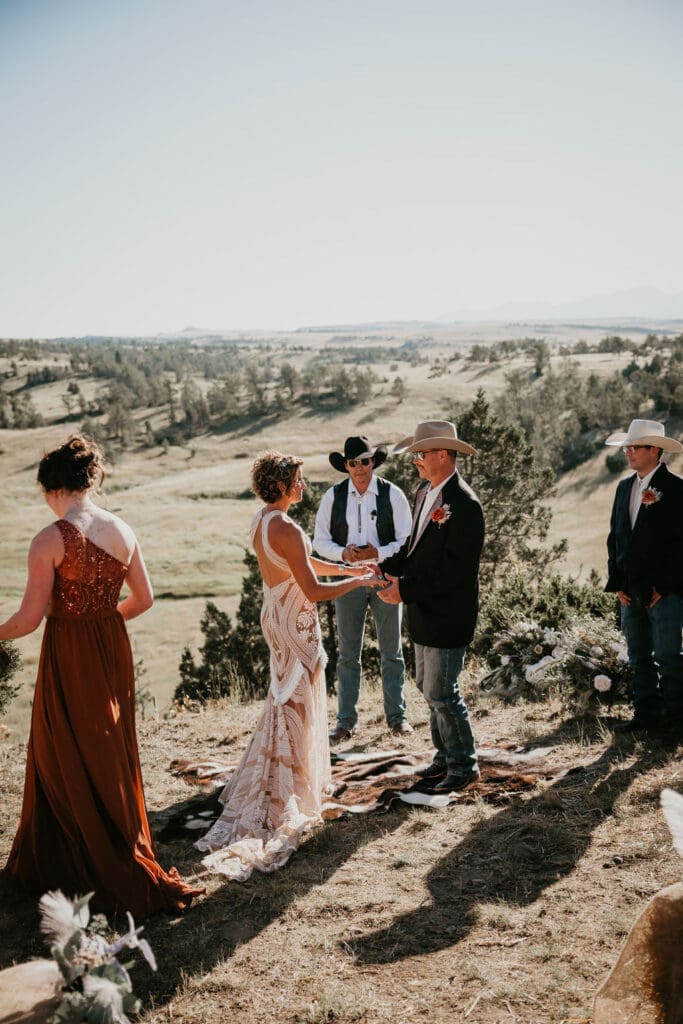 Wedding couple sharing candid laugh during portraits in Eastern Montana.