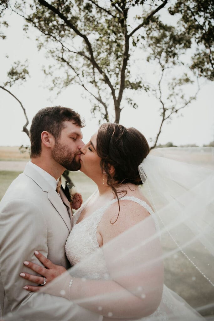 Bride’s veil blowing in the wind during golden hour portraits
