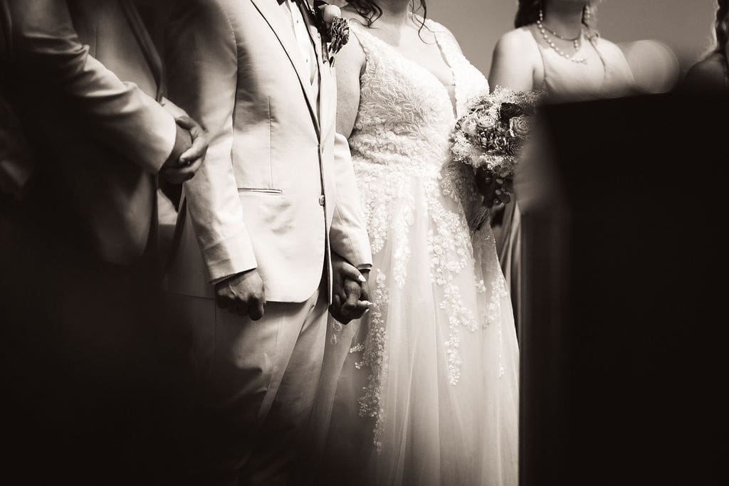 Hands clasped during prayer at Billings Montana wedding