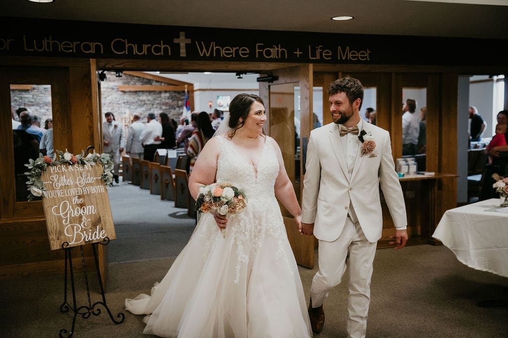 Bride walking down aisle with emotional family in Billings church