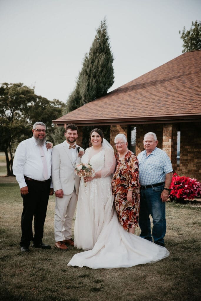 Bride hugging family after ceremony at Billings wedding