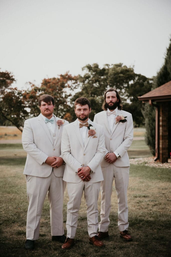 Group portrait with wedding party under tree canopy in Billings