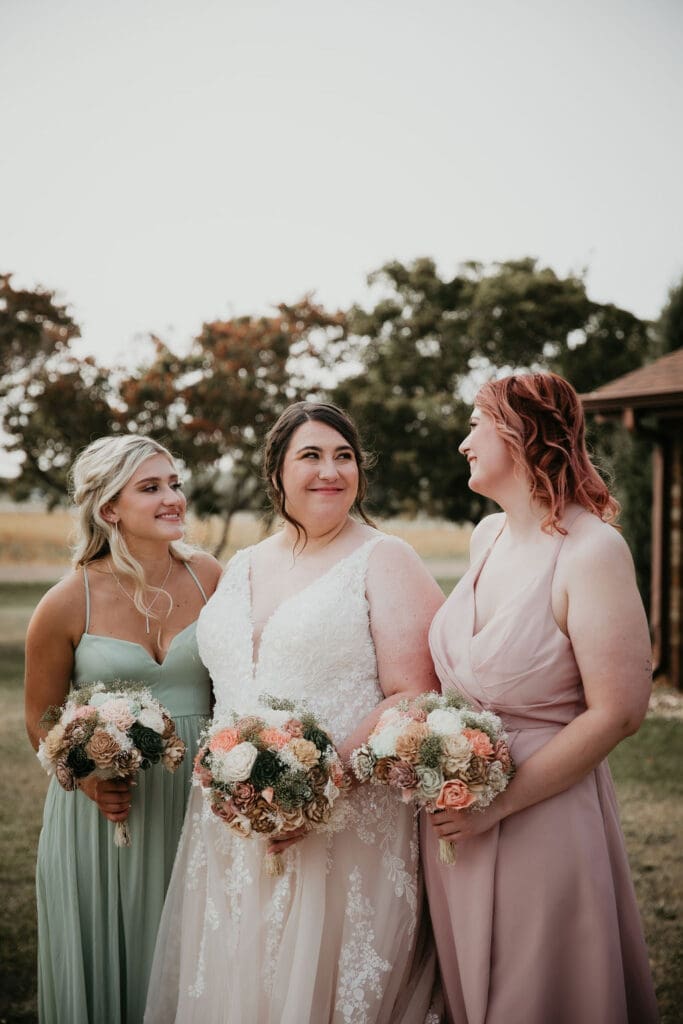Bridesmaids in champagne dresses outside Billings Montana wedding venue