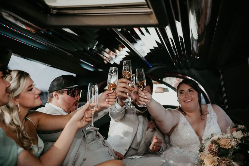 Champagne toast in limo after Billings wedding ceremony