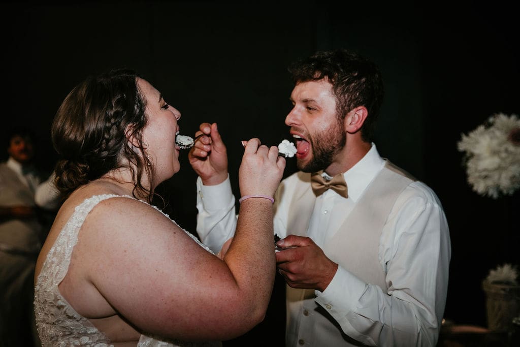 Bride feeding cake to groom at Billings Montana reception