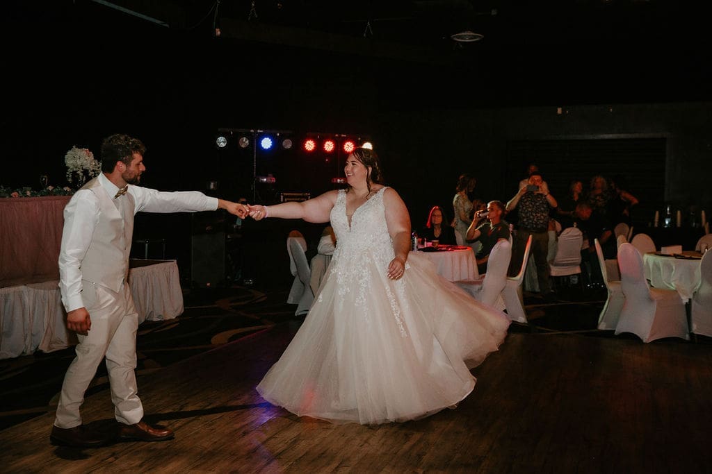 Bride twirling on dance floor during Billings reception