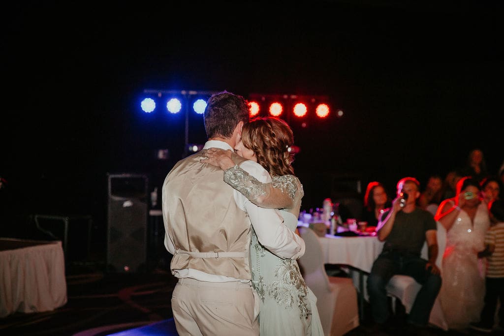 Groom dancing with bride’s mom at Montana wedding