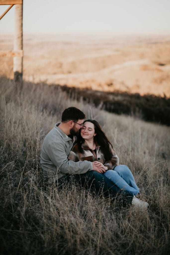 Tender moment as Tanner and Jaycie share a kiss at the edge of the dam near Miles City, Montana.