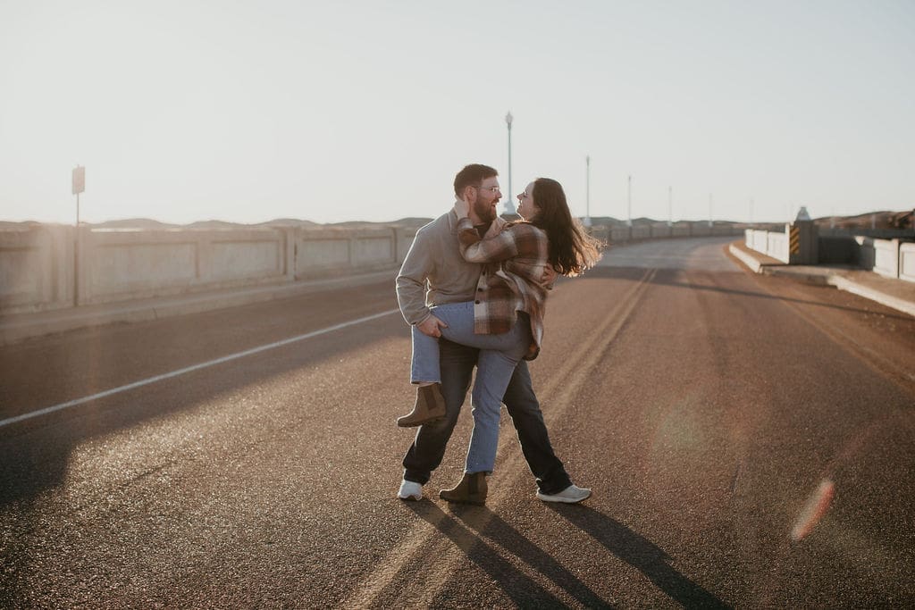 Intimate engagement photo with soft sunset light and rolling Eastern Montana hills.