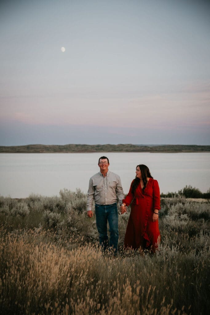 Mariah laughing after surprise proposal at Fort Peck Lake, captured by Glasgow engagement photographer